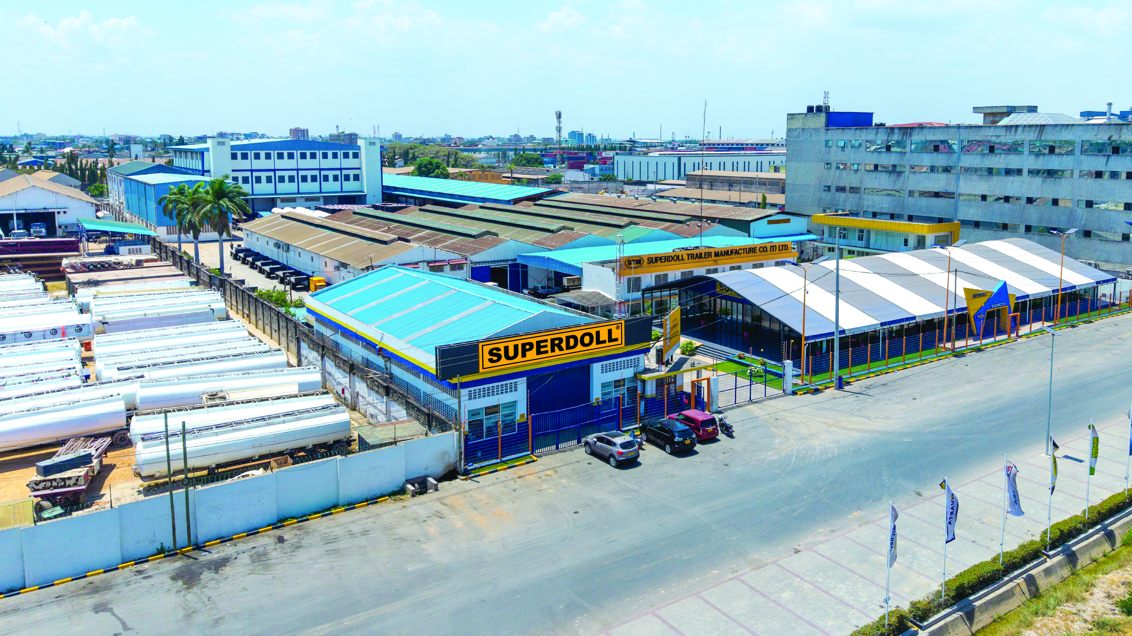 Aerial view of the Superdoll Trailer Manufacture headquarters in Dar es Salaam, with fleet vehicles parked outside